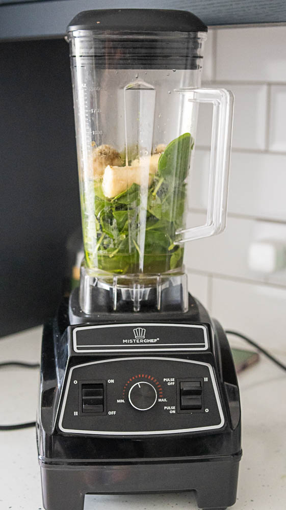 Blender with fruits making smoothie 