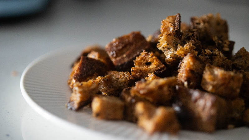 Plate with baked pieces of Croutons
