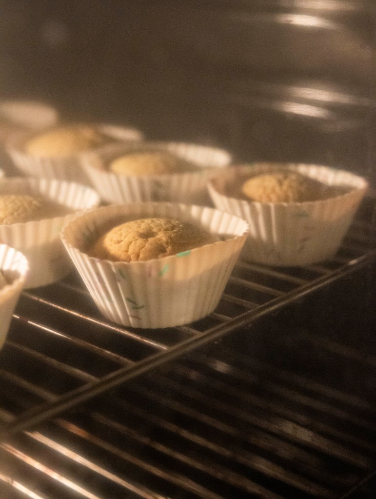 Cupcakes during baking in the oven